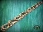 a green background with a decorative design on it