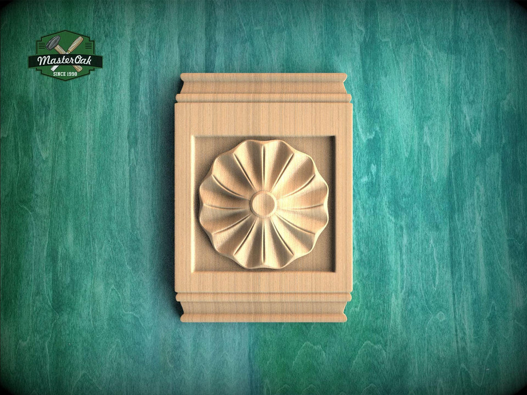 a wooden panel with a decorative flower design, set against a green background.
