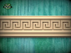 a decorative wooden border with a repeating Greek key pattern, set against a green textured background.