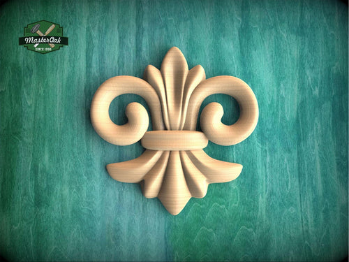 a wood carving of a fleur de lis on a green background