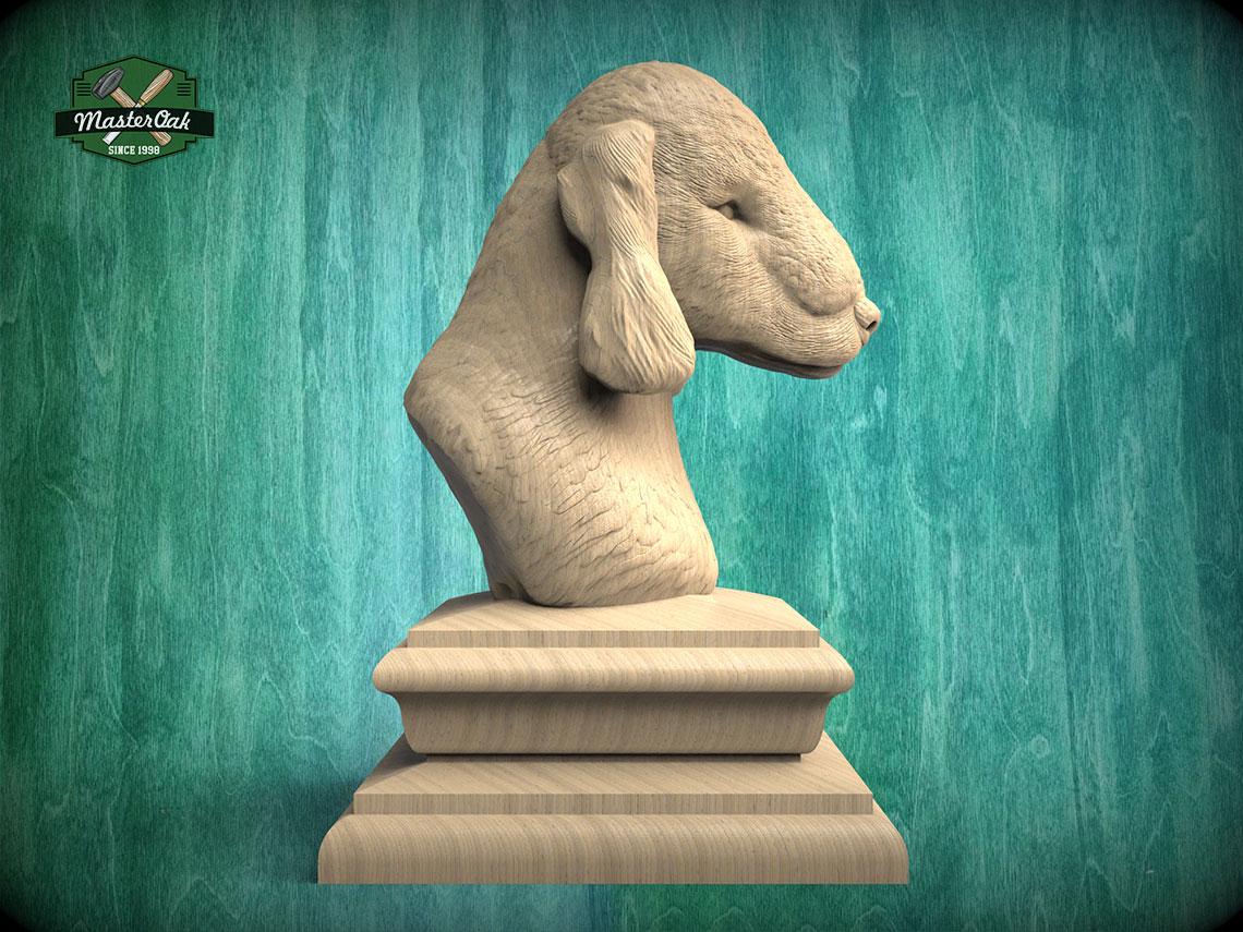 A wooden bust of a dog's head is displayed on a wooden pedestal against a green background.