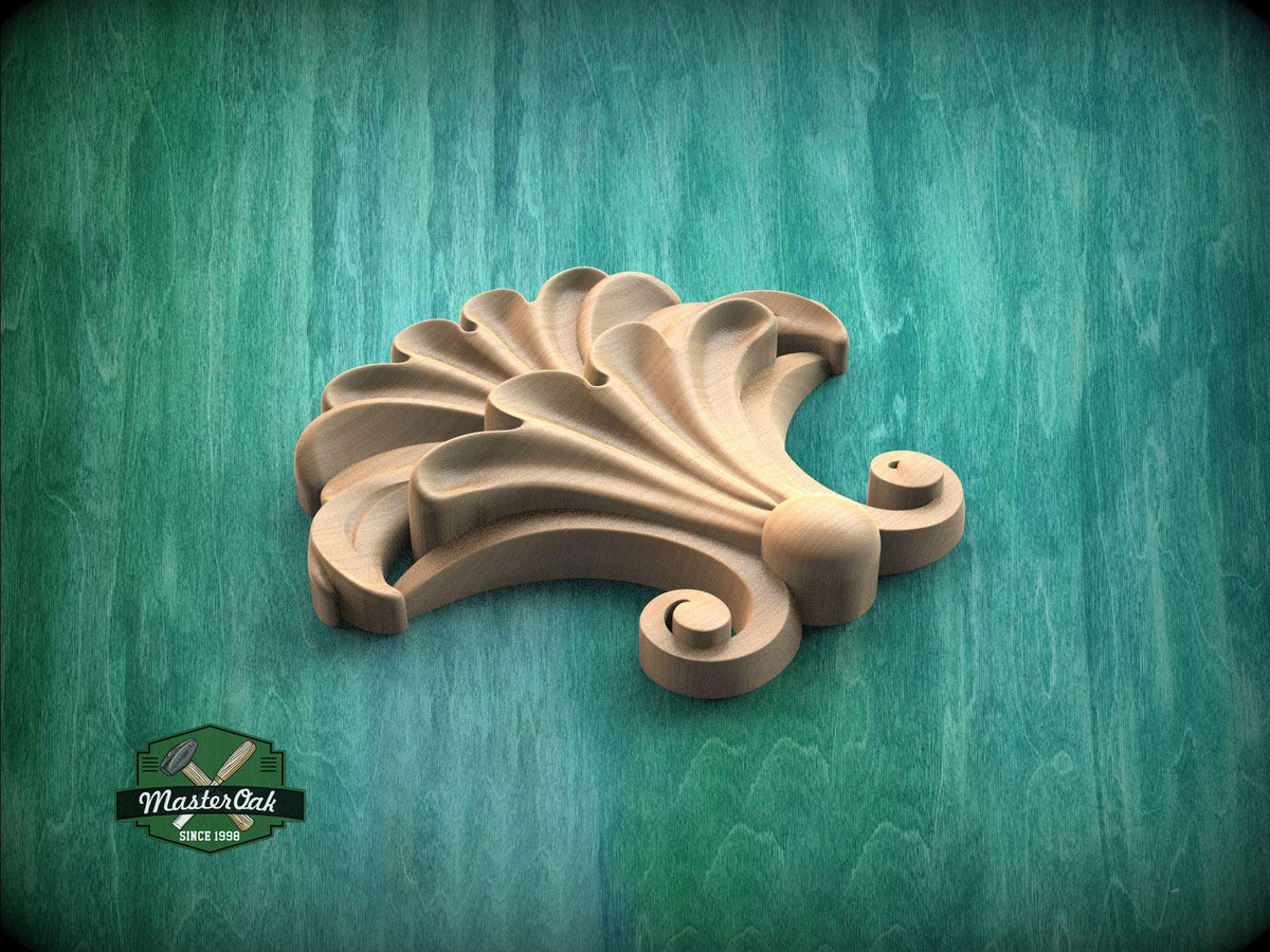 A wooden carving of a stylized flower or shell-like shape is displayed against a green background.