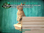 a wooden statue of a cat sitting on top of a wooden box