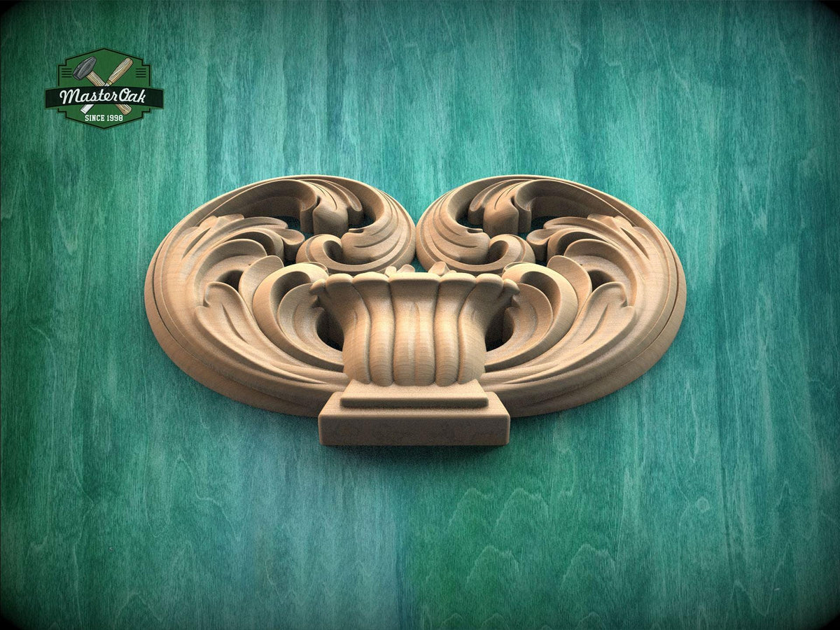 a carved wooden piece with an intricate, swirling design on a green background.