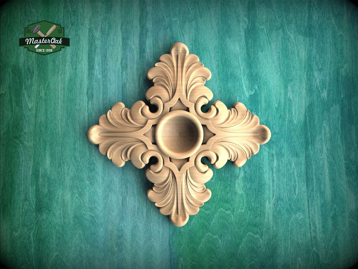 a decorative wooden piece with an intricate design, placed against a green background.