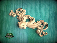 Load image into Gallery viewer, A decorative wooden carving in the shape of a stylized flower or plant is displayed against a teal background.
