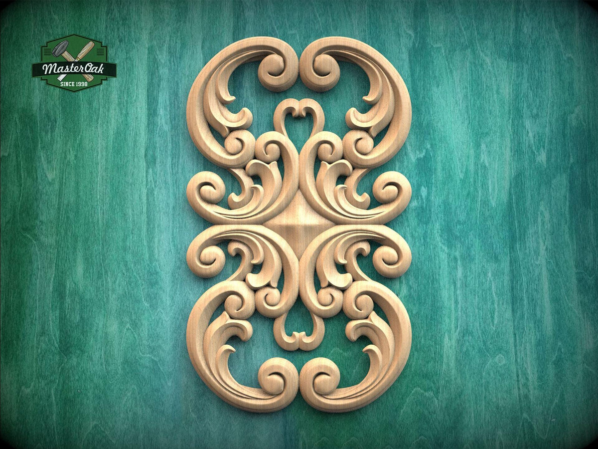 an ornate, carved wooden design with intricate scrollwork and swirls, set against a green background.