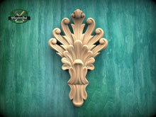 Load image into Gallery viewer, a decorative wooden carving on a green background.
