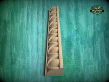 Load image into Gallery viewer, A wooden decorative element, possibly a mold or carving, is displayed against a green textured background.
