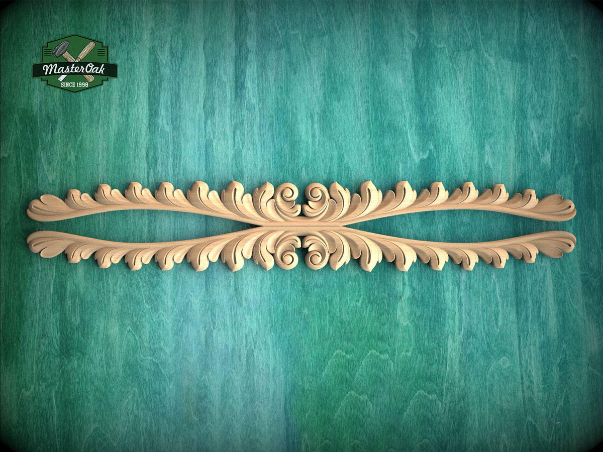 a decorative wooden piece with an intricate design, placed on a green textured background.