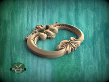 Load image into Gallery viewer, A wooden ornate door handle with intricate carvings is displayed against a teal background.
