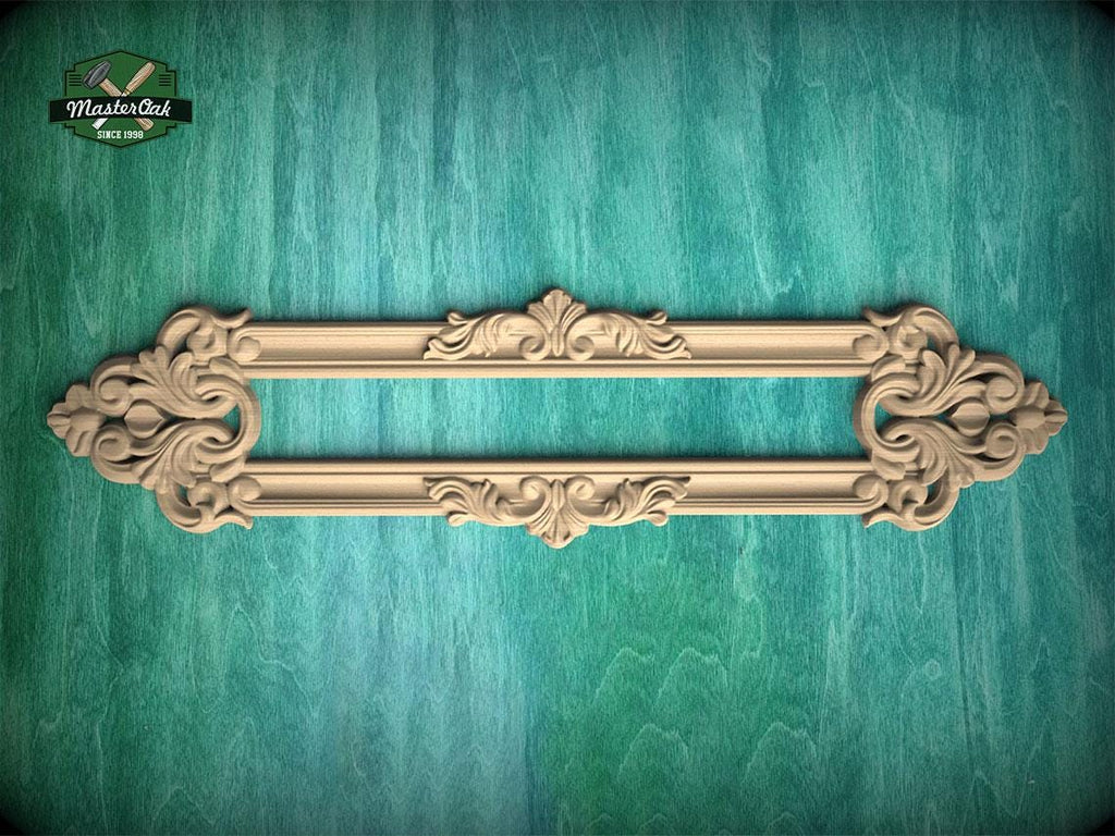 a decorative wooden frame with intricate carvings, displayed against a green textured background.