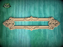 Load image into Gallery viewer, a decorative wooden frame with intricate carvings, displayed against a green textured background.
