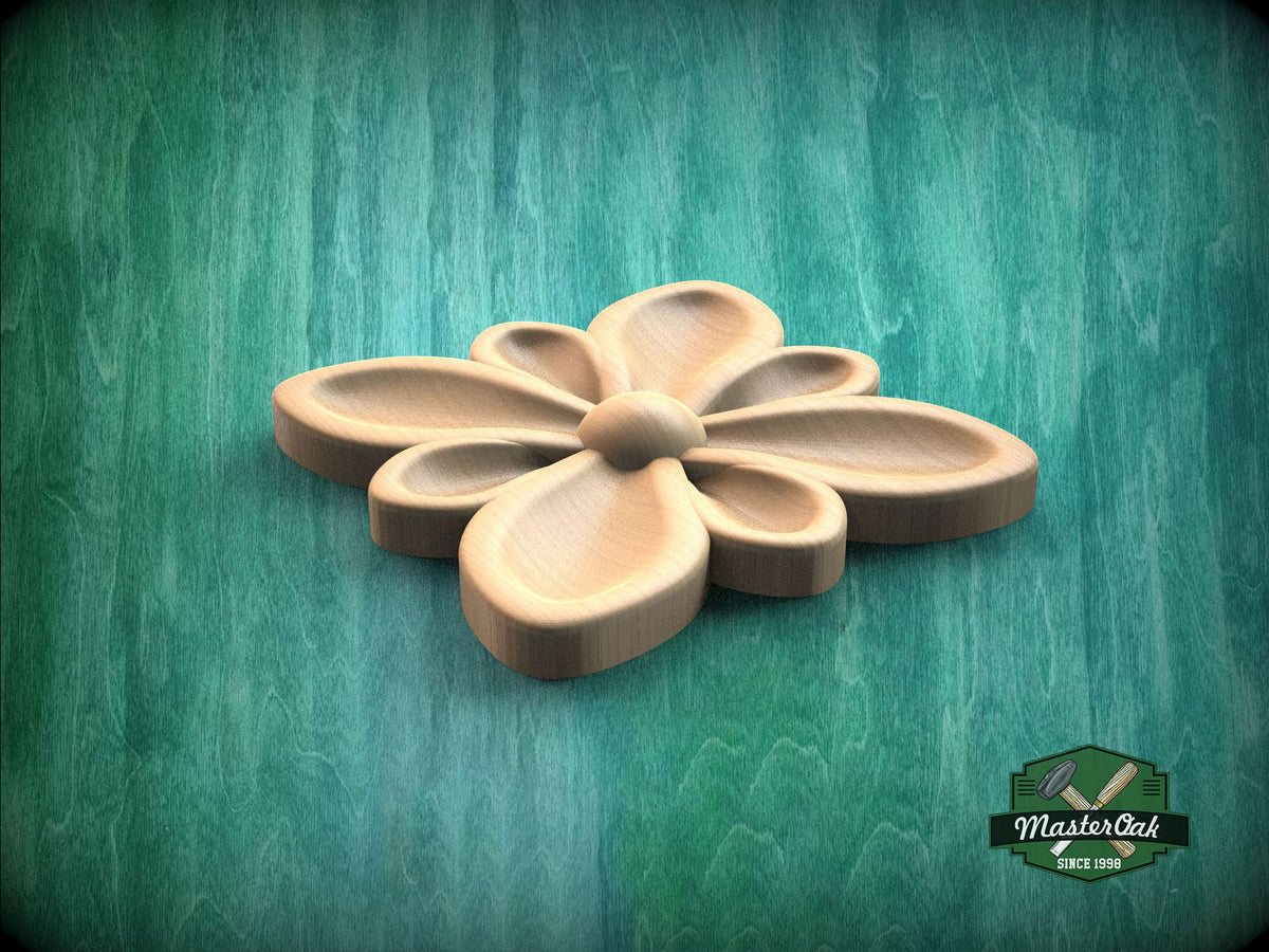 A wooden flower-shaped object is displayed against a green background.