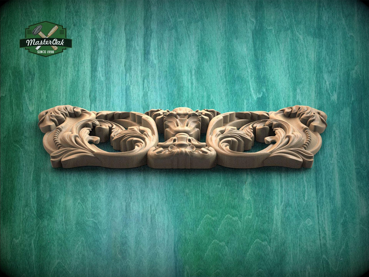 A carved wooden piece with intricate floral designs is displayed against a green background.