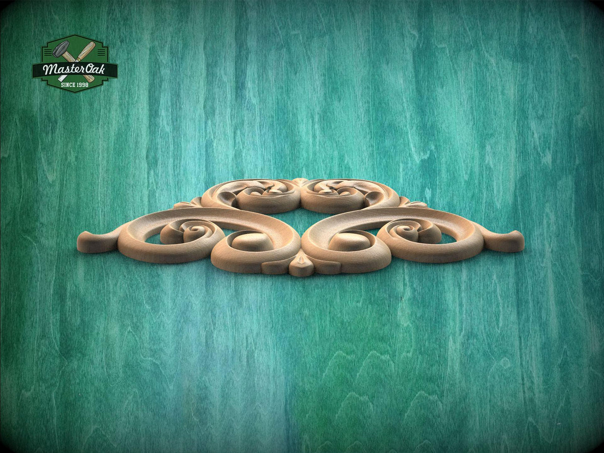 A decorative wooden carving with intricate scrollwork is displayed against a textured green background.