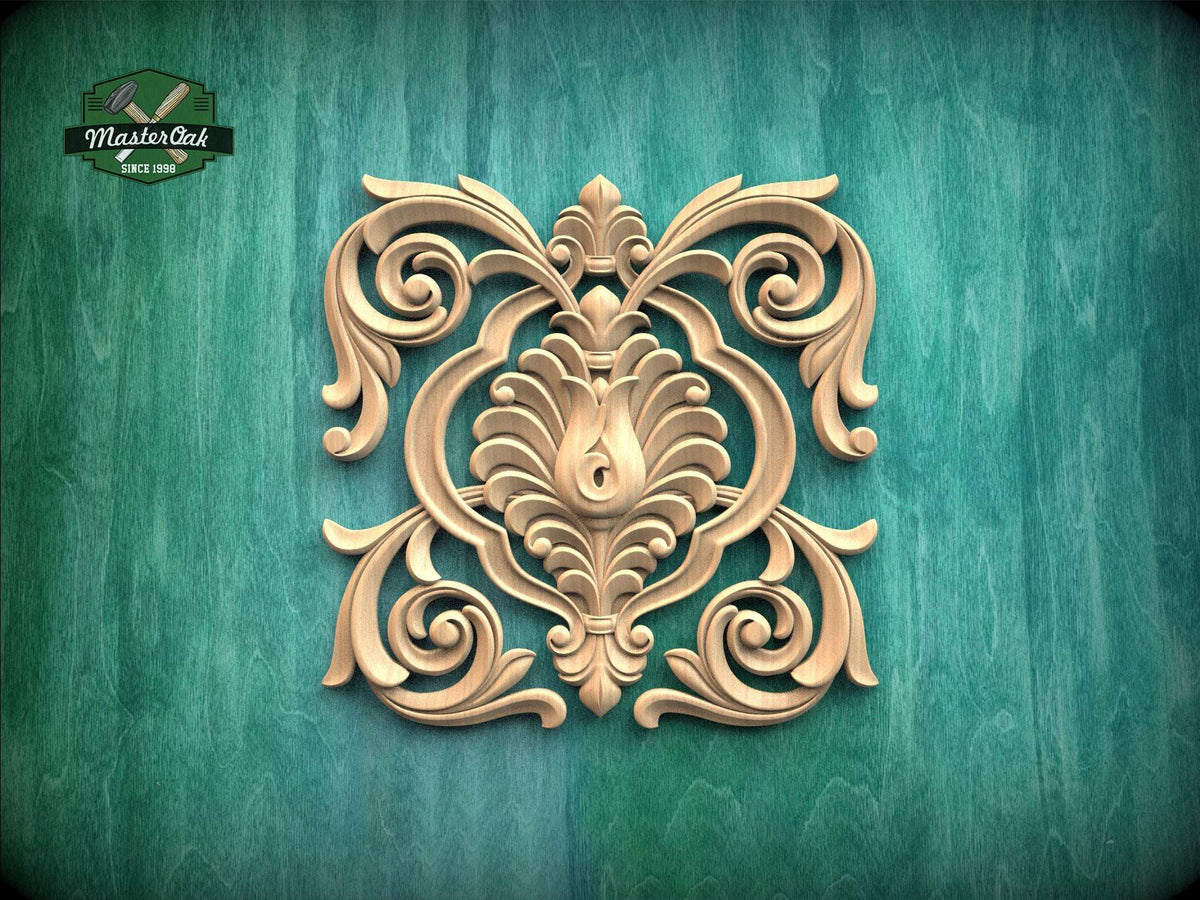 an ornate, carved wooden design with intricate scrollwork and floral patterns, set against a green background.
