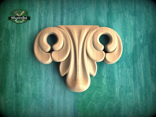 A wooden ornamental piece with a decorative scroll-like design is displayed against a green background.