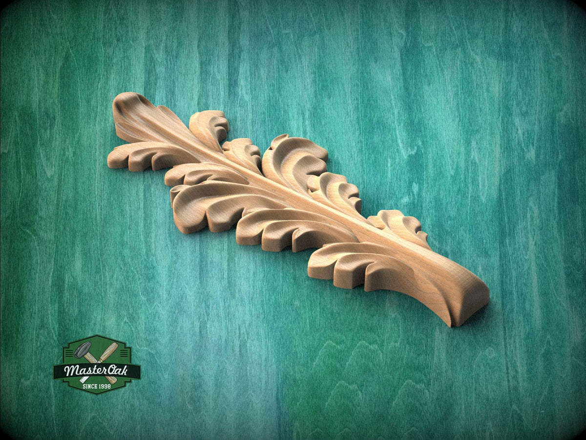 A wooden carving of a leaf-like design is displayed against a green background.