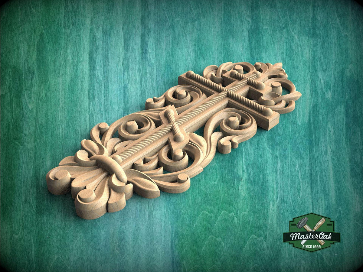 A decorative wooden carving with intricate floral and scrollwork designs is displayed against a green background.