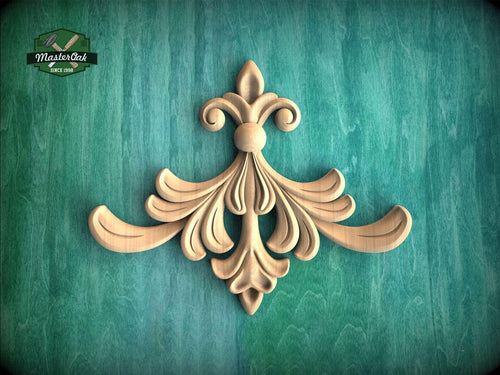 a decorative wooden carving on a green background.