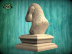 A wooden bust of a dog's head is displayed on a wooden pedestal against a green background.