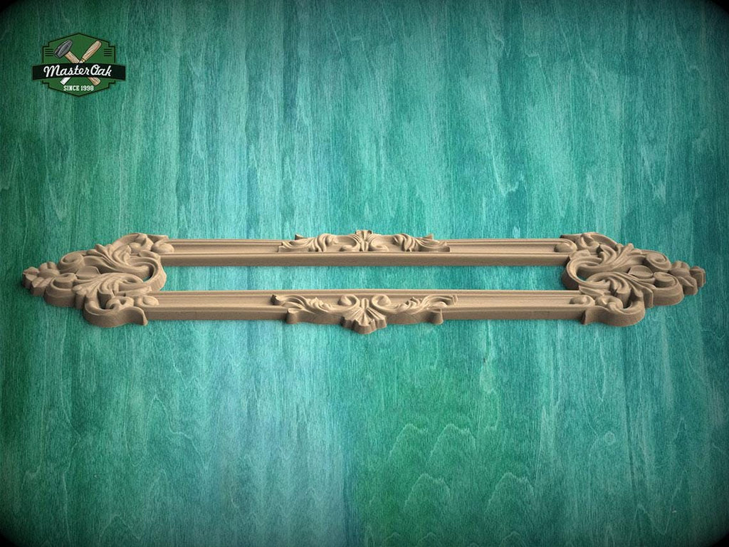 a decorative wooden frame with intricate carvings, displayed against a textured green background.
