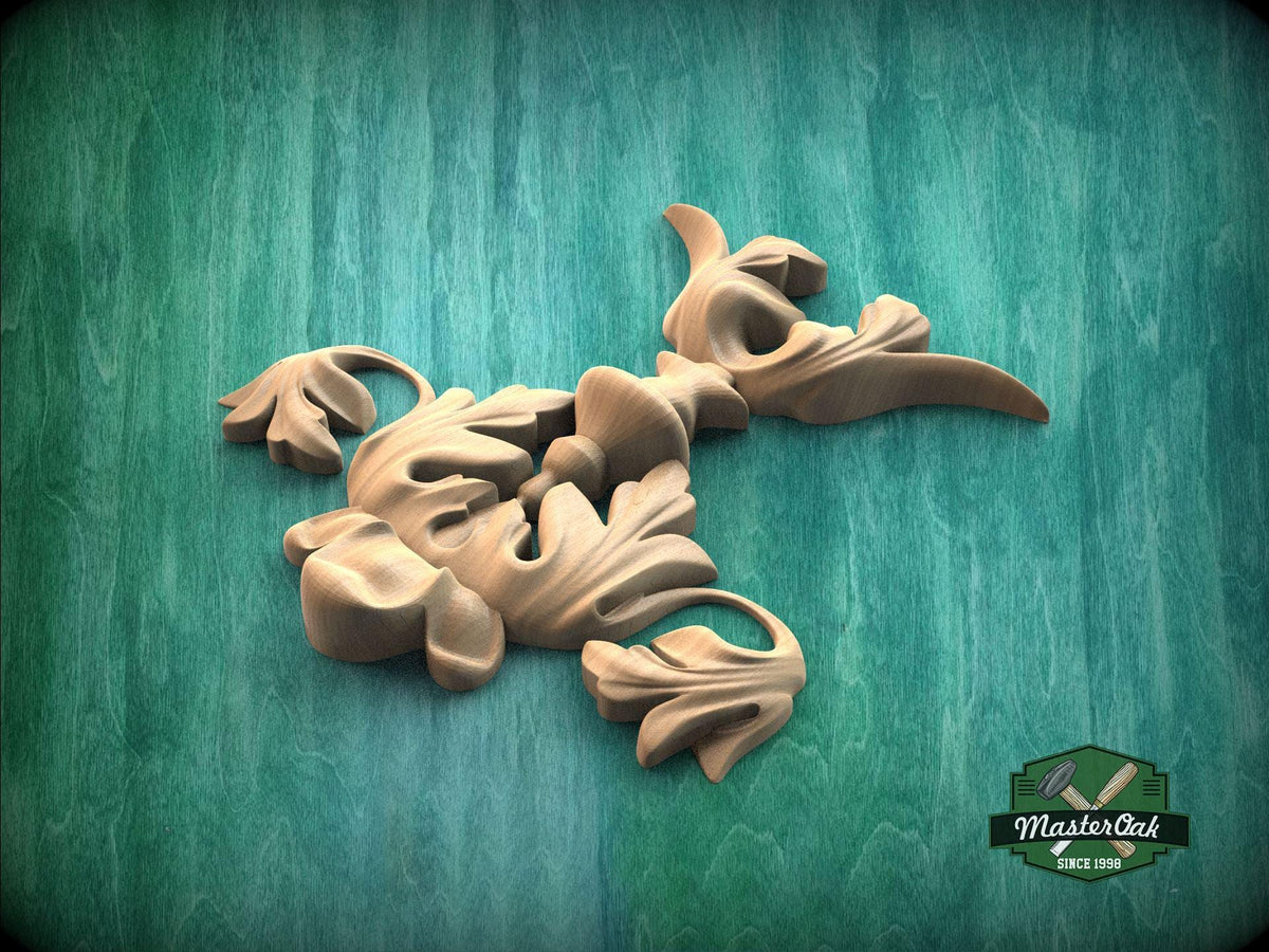 a collection of wooden sculptures or carvings, including a bird-like figure, against a green background.