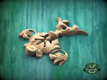 Load image into Gallery viewer, a collection of wooden sculptures or carvings, including a bird-like figure, against a green background.
