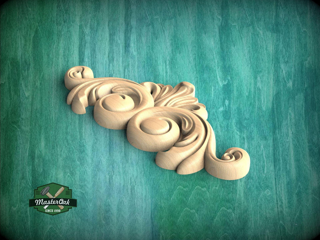 A decorative wooden carving in the shape of a swirl or scroll is displayed against a green background.