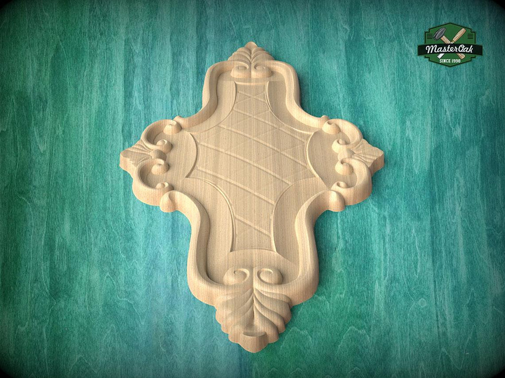 a wooden carving of a cross-shaped design on a green background.