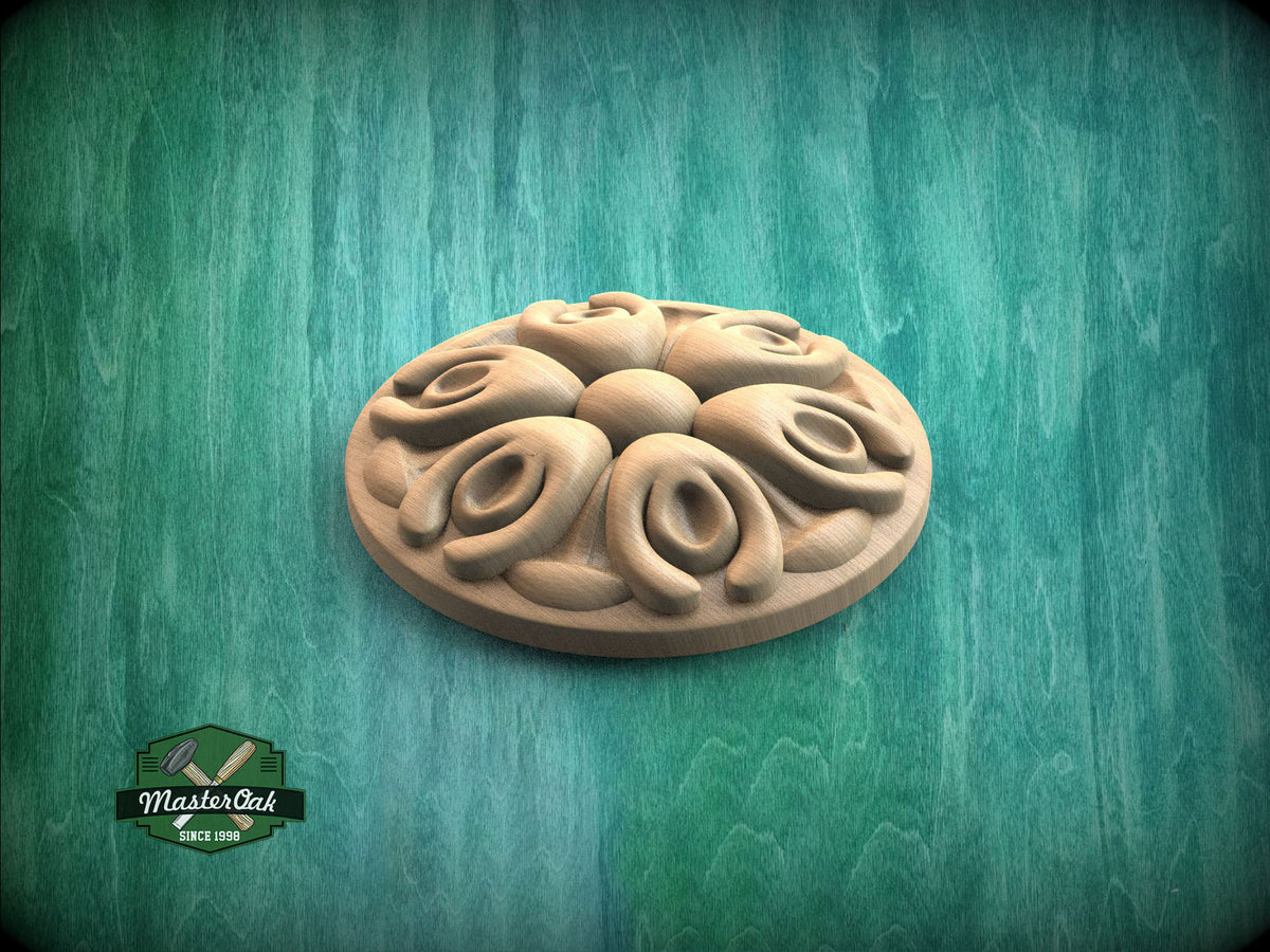 A wooden decorative piece with a floral design is displayed against a green background.