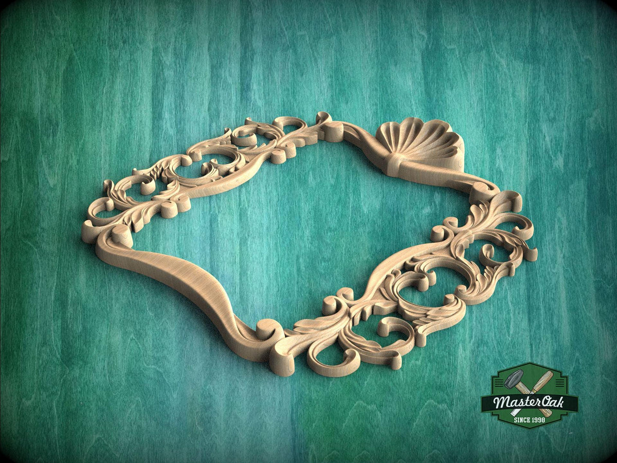 A wooden ornate frame with intricate scrollwork and a shell-like design, set against a green textured background.