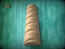 Load image into Gallery viewer, A wooden wall-mounted shelf with a curved design, set against a green textured background.
