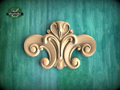 a decorative wooden carving on a green background.