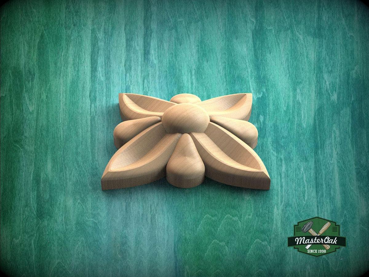A wooden flower-shaped object is displayed against a green background.