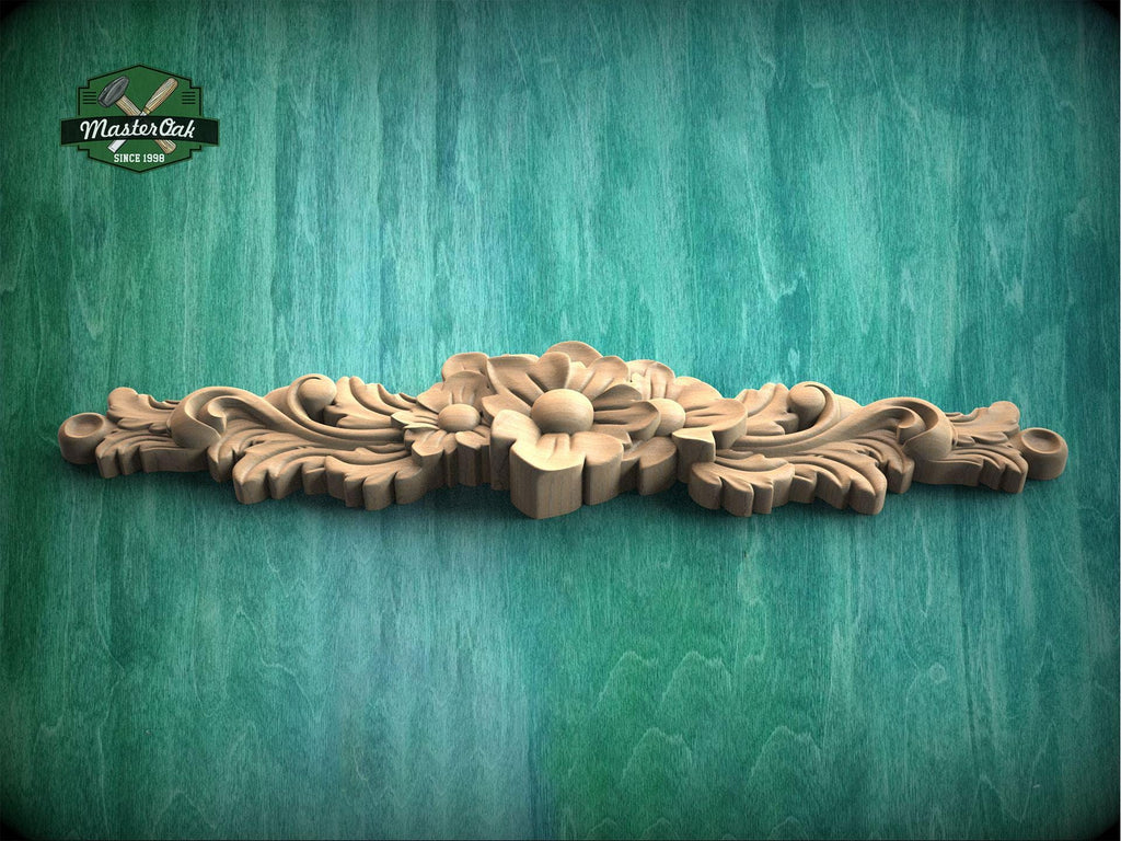 a wood carving of a flower on a green background