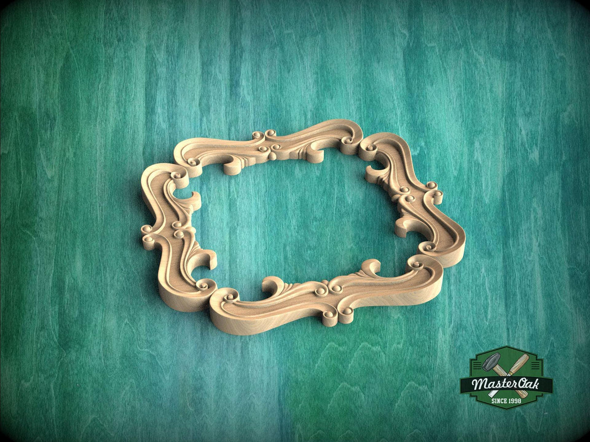 A wooden ornate frame with intricate scrollwork is displayed against a green textured background.