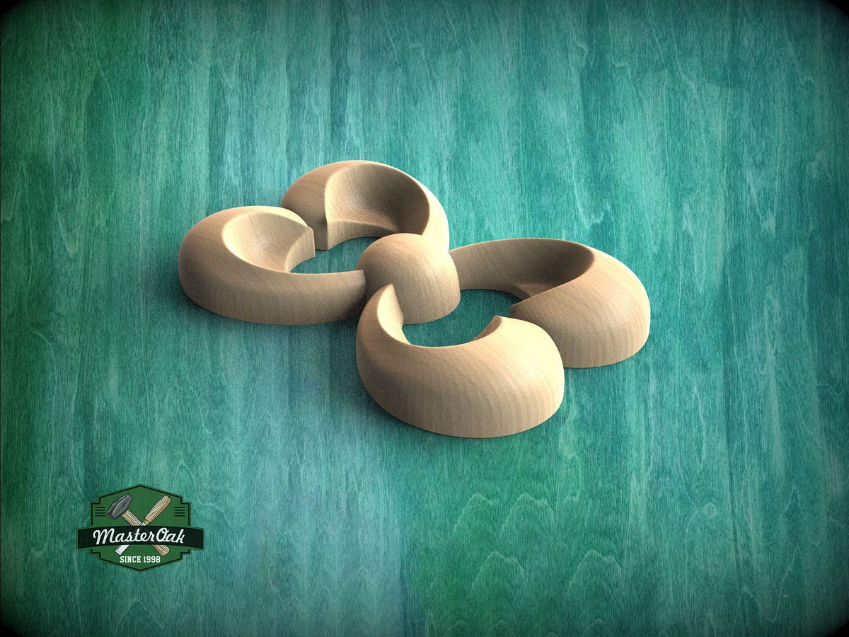 A wooden sculpture in the shape of a flower is displayed against a teal background.