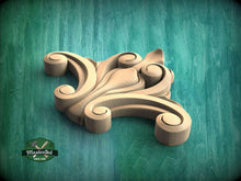 Load image into Gallery viewer, A wooden carving of a stylized flower or floral design is displayed against a green background.
