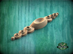 a group of wooden objects sitting on top of a green surface