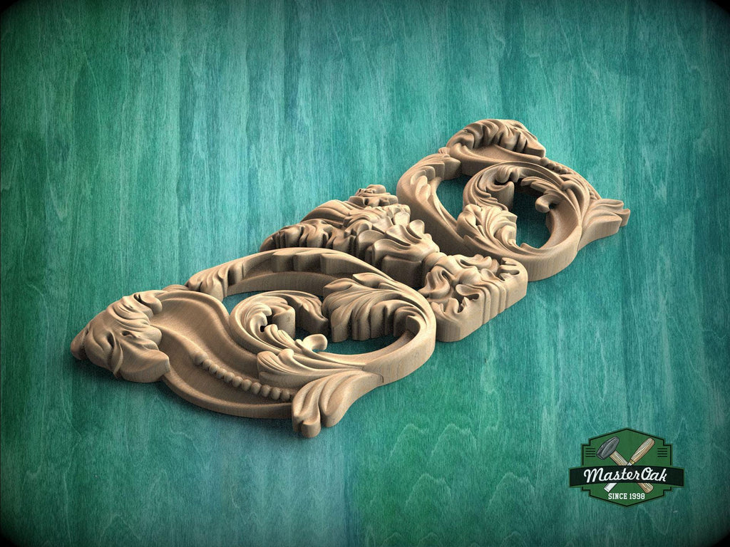 A wooden carving with intricate floral and scroll designs is displayed against a green background.