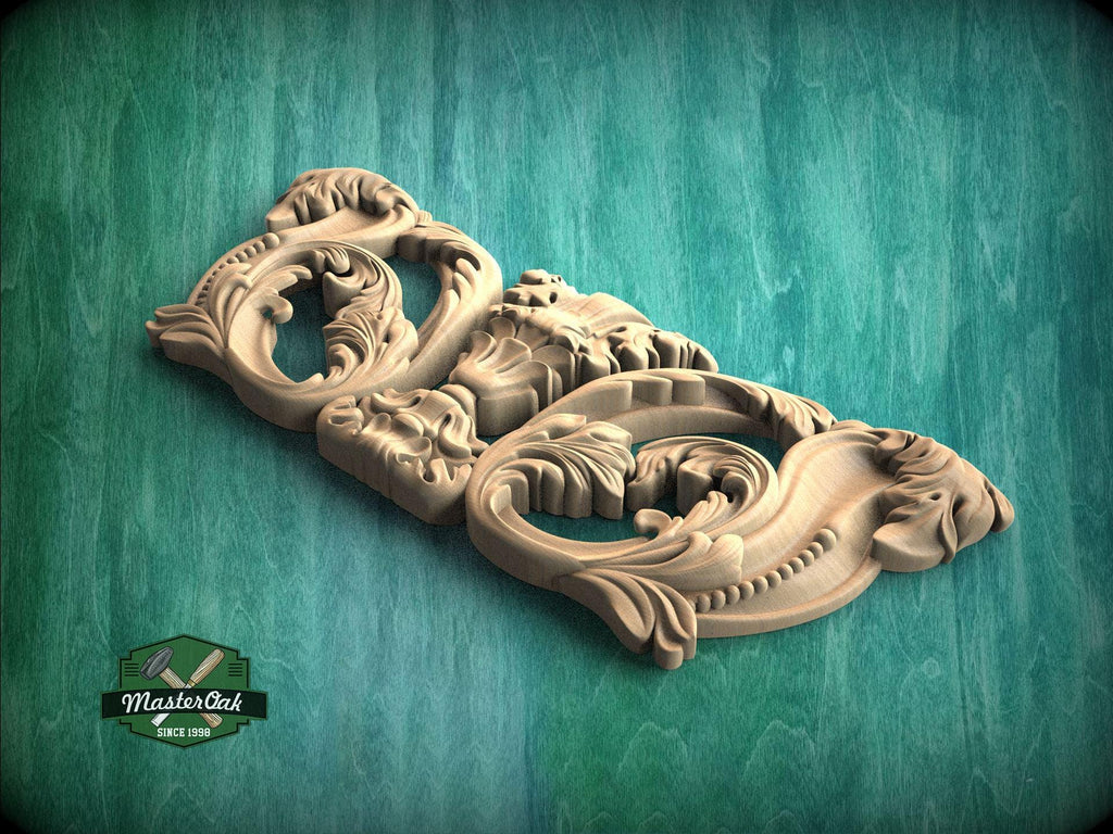 A carved wooden panel with intricate floral and scroll designs, displayed against a green background.
