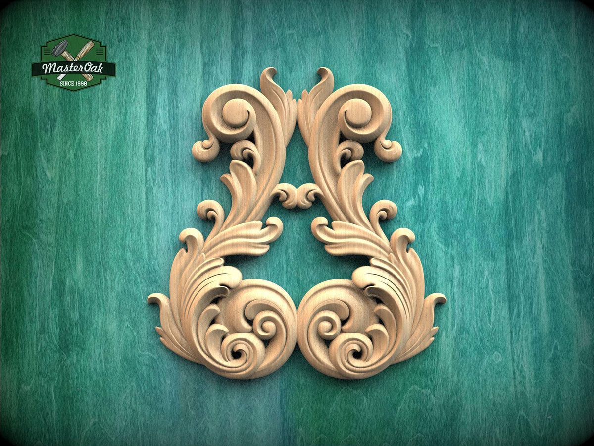 a decorative wooden carving of a stylized floral design on a green background.