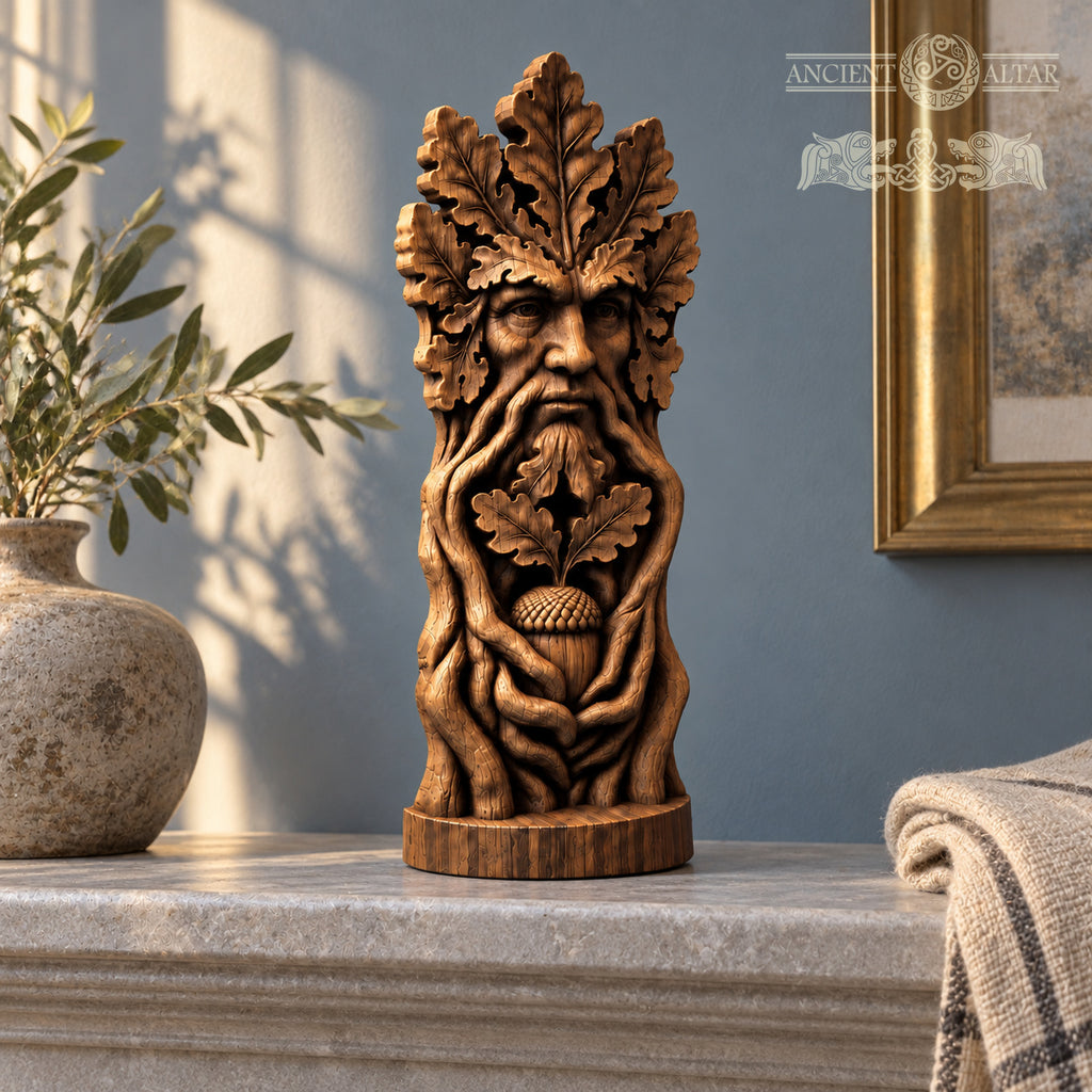 A wooden sculpture of a face with a leafy beard and an acorn in its mouth, placed on a marble surface.