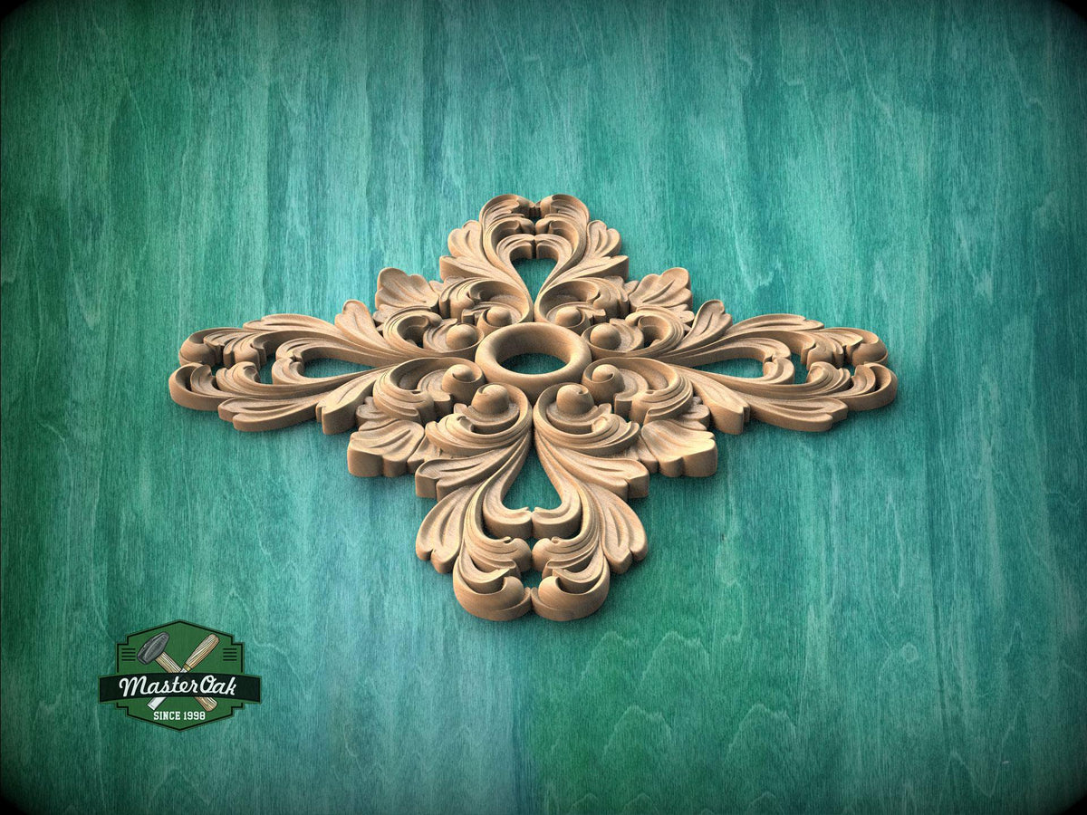 A decorative wooden carving in the shape of a flower or leaf design is displayed against a green background.