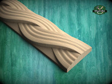 Load image into Gallery viewer, A wooden carving with a curved, wavy design is displayed against a green background.
