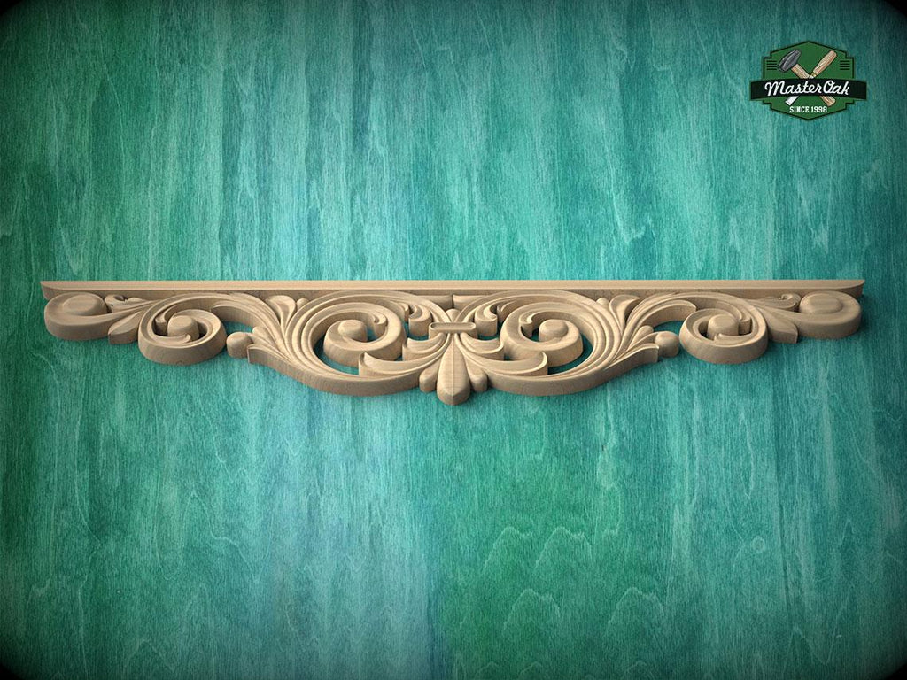 A decorative wooden molding with an intricate scrollwork design is displayed against a green textured background.