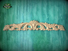 Load image into Gallery viewer, a decorative wooden carving on a green background.
