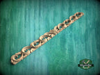 a decorative wooden object on a green background